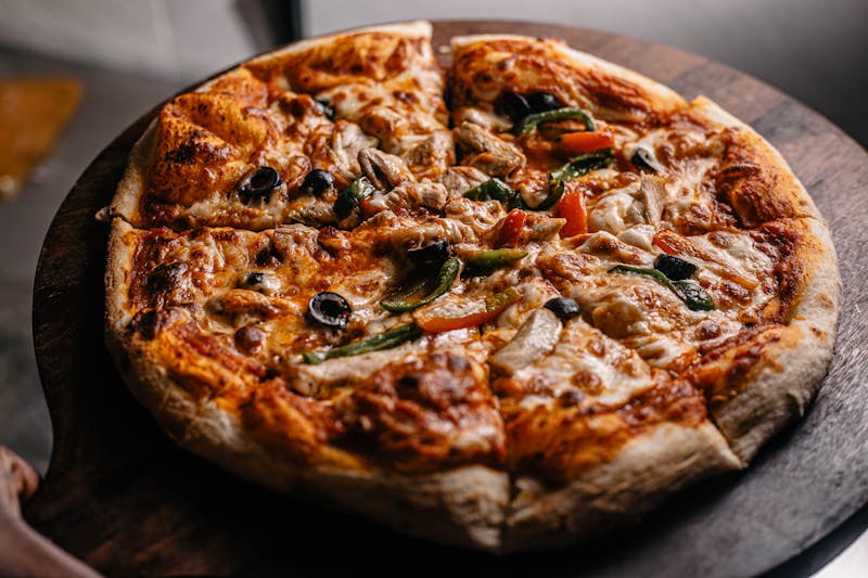 Close-up of a freshly baked pizza with golden cheese